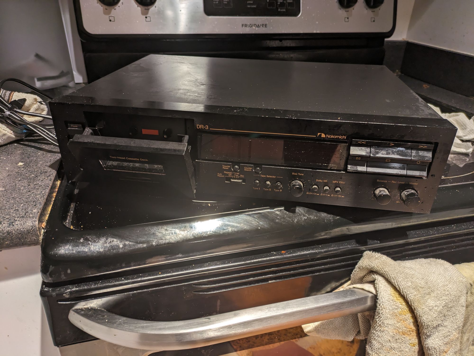 A picture of the Nakamichi DR-3 on top of a ceramic stove